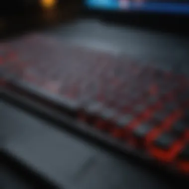 Close-up of slim gaming laptop keyboard with illuminated keys