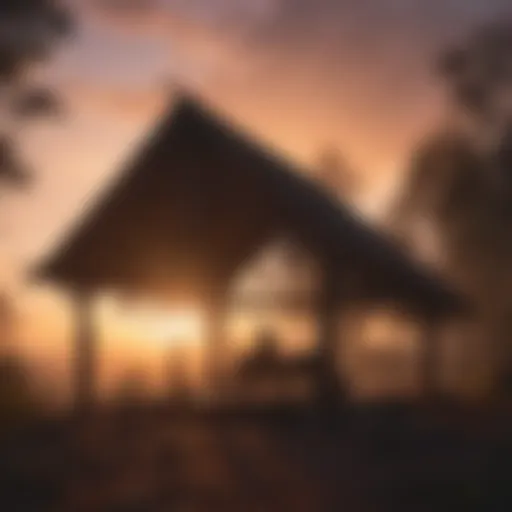 Silhouette of person building a shelter against a vibrant sunset